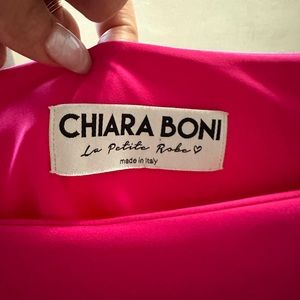 A beautiful hot pink elegant dress it’s like a medium size 38